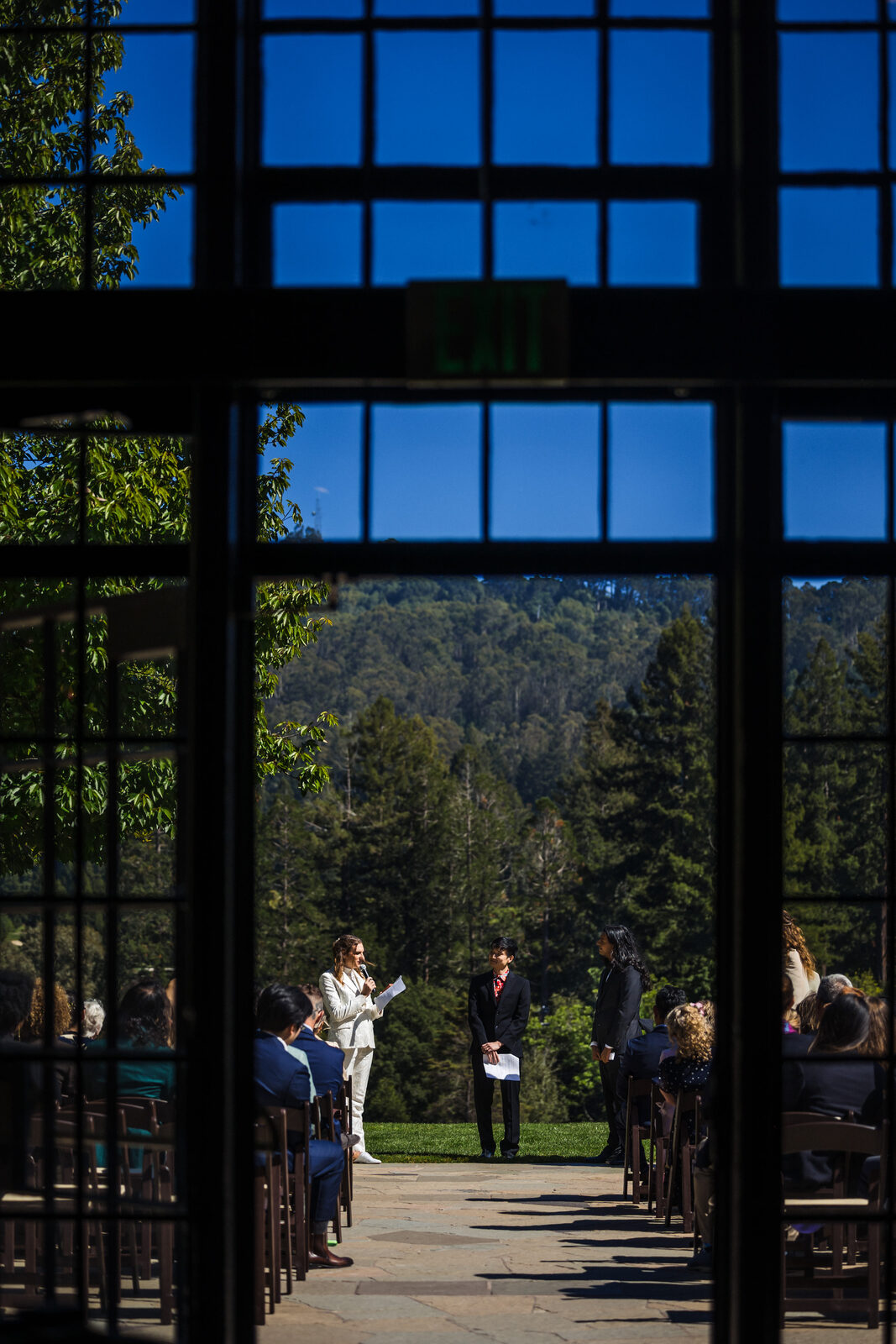 The ceremony glimpsed through the Brazilian Room's great window